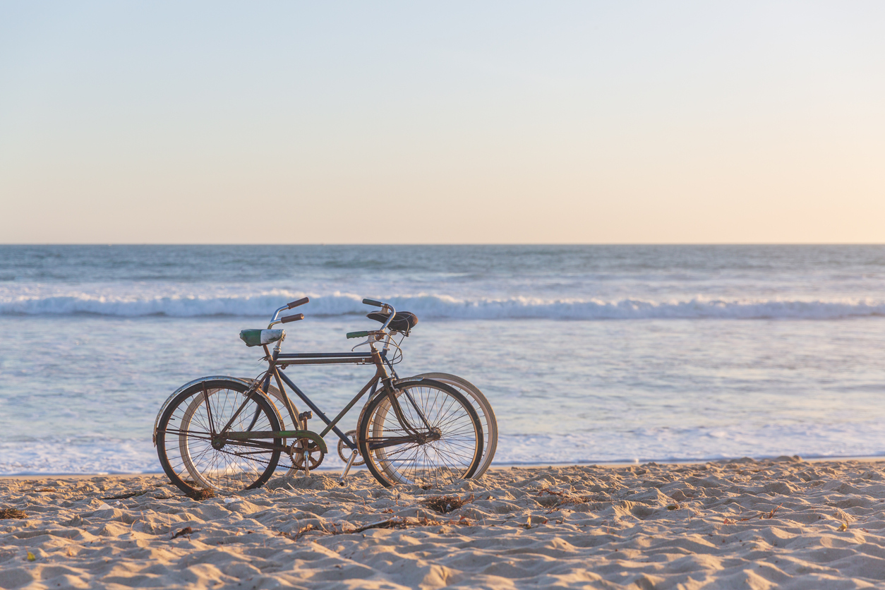 Cyclist riding beside the beach