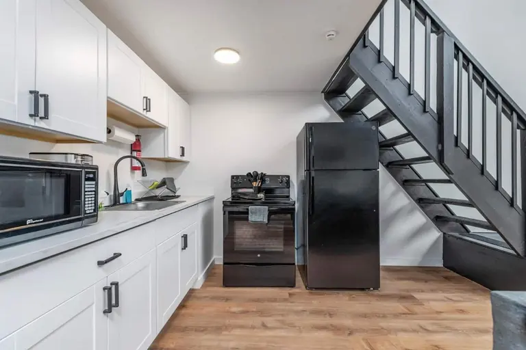 Kitchen and stairs in Tidal House Chalet 4.