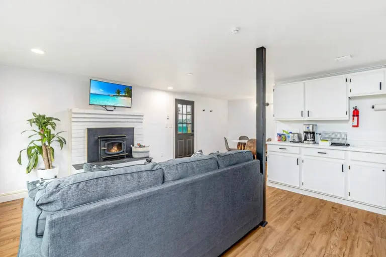 Open living room and kitchen in Tidal House Chalet 6.