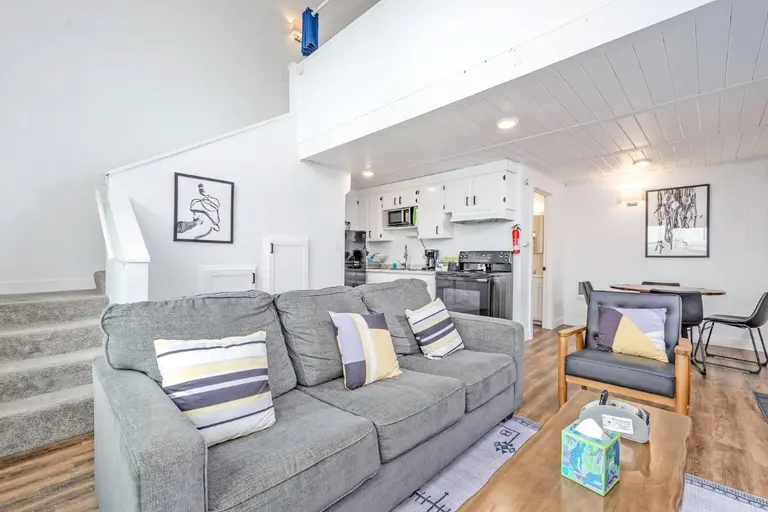 Open living room and kitchen in Tidal House Chalet 9.
